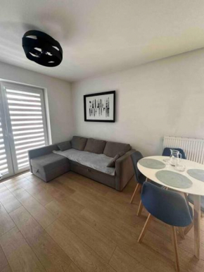 Przytulny apartament z dużym balkonem